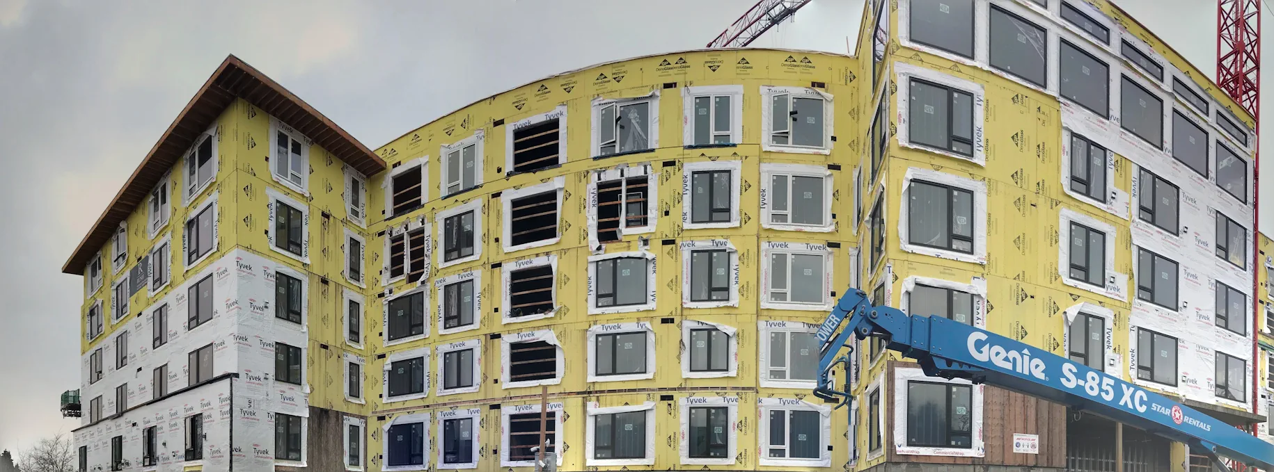 Yellow siding building with lift